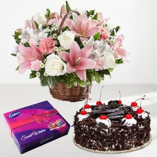 Basket of 15 mix flowers with black forest fresh cream cake with box of cadburys celebration chocolates 