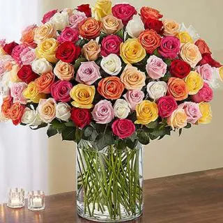 100 mix roses arranged  in glass vase 