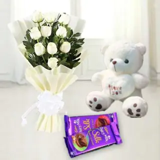  Bunch of white roses with 6 inch teddy bear & set of 2 dairy milk silk chocolate