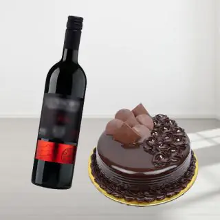 double chocolate cake with bottle of red wine