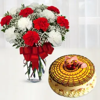 15 red and white carnations in glass vase with butterscotch premium quality cool cake 