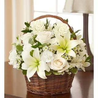 Arrangement of fresh white lilies with white roses with white astromeria