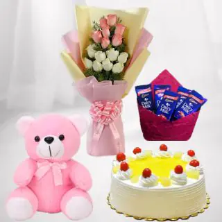 Bunch of 10 pink and white roses with 6 inch teddybear with pineapple cake with pack of 5 dairy milk chocolates 