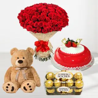 Beautiful Bouquet of 100 red dutch roses, with 1 feet height teddybear, strawberry cool cake with 16 pcs rocher ferrero chocolates  