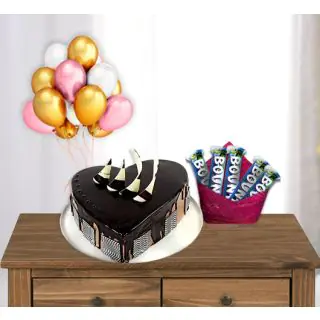  heart shape chocolate cake with pack of 5 bounty chocolates with bunch of 5 blown balloons 