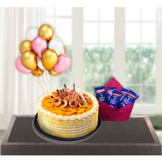  Honey cake with pack of 5 dairy milk chocolates with bunch of 5 blown balloons 