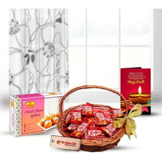 Motichoor laddoo , Basket of KitKat chocolates with Diwali greeting card 
