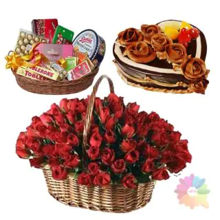 Basket of 60 red roses with chocolate heart shape cake with exotic fruits topping with chocolate hamper of premium quality chocolates