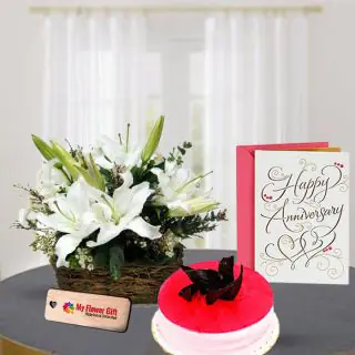 Exotic basket arrangement of 20 white flowers in mix combination with half kg strawberry cake with anniversary card 