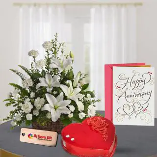 Exotic Basket arrangement of white flowers with 1 kg red velvet cake with anniversary card 