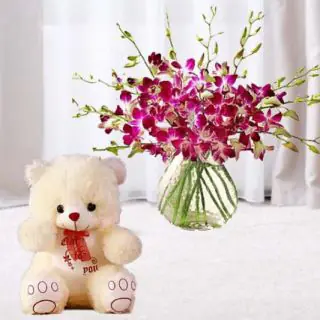 10 purple orchids in glass vase with cute 1 feet heigh teddy bear 