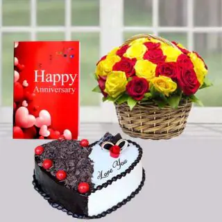 Basket of 15 red and yellow roses,  black forest heart shape cake, anniversary greeting card 