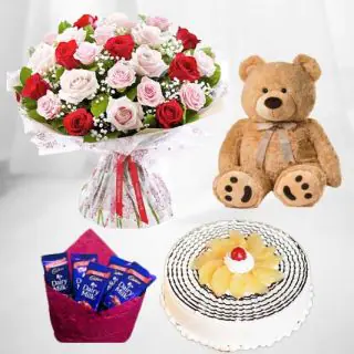 20 red and pink roses bouquet with 1 feet height brown teddybear with pack of 5 dairy milk chocolates with pineapple cake 