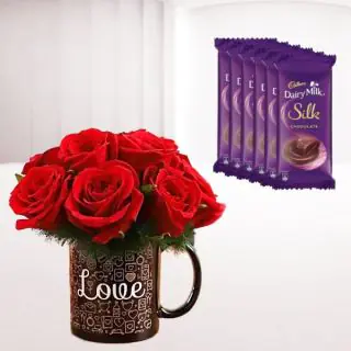 5 red roses arranged in photo mug with set of 6 dairy milk silk chocolates 