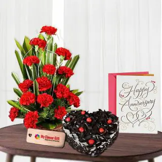 20 red carnations basket with 1 kg black forest heart shape cake with anniversary card