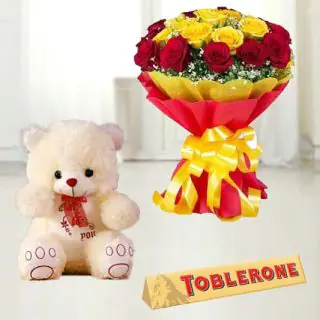  Bouquet of 15 red and yellow roses with 1 feet height teddy bear & toblerone chocolate 