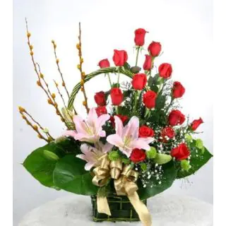 basket of red roses with pink lily