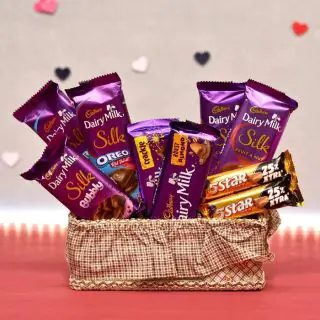 Basket arrangement of 7 dairy milk silk chocolates, 2 fivestar chocolates 
