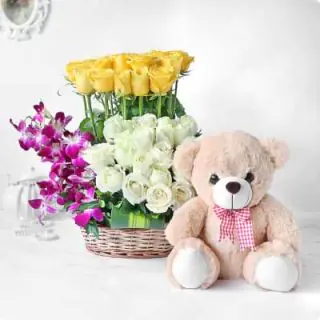 Basket of yellow and white roses and lavender orchids with 6 inch teddy bear 