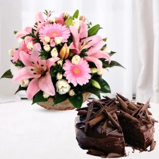 basket of lilies and gerberas with chocolate truffle cool cake 