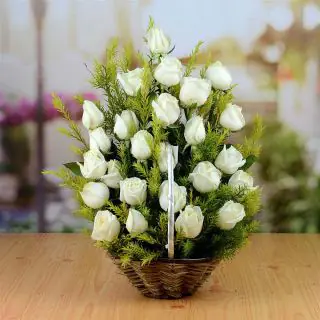 Beautiful basket arrangement of 30 white roses 