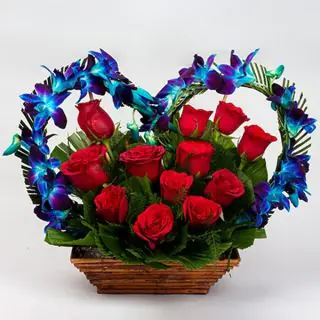 Beautiful Basket of 8 Blue orchids with 12 red roses 