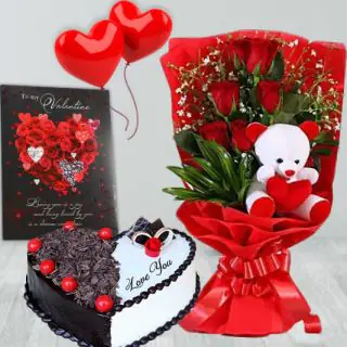 Beautiful bunch of 6 red roses with teddybear sitting in it, half kg heart shape black forest cake, valentine card, 2 heart shape balloons