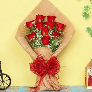 Beautiful hand bouquet of 12 red roses with jute packing 