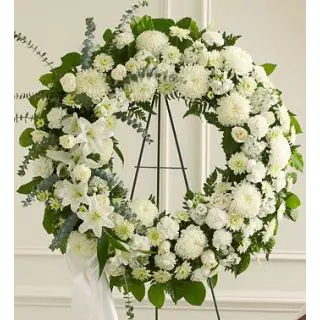 Beautiful wreath of white exotic condolence flowers 
