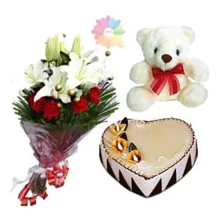 bunch of white lilies with red carnations with heart shape butterscotch cake with 6 inch teddybear