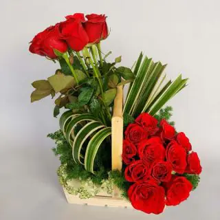 Designer basket arrangement of 25 red roses 