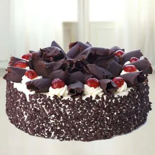  black forest anniversary cake with chocolate flakes topping 