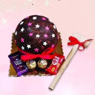 Half kg chocolate piñata cake with dairy milk, kitkat and rocher ferrero chocolates