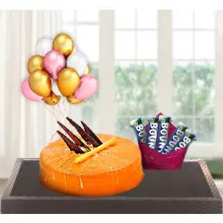  orange cool cake with pack of 5 bounty chocolates with bunch of 5 blown balloons 
