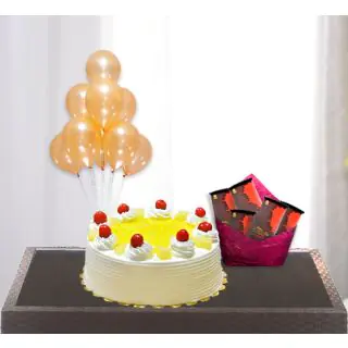  pineapple cool cake with pack of 5 bournville chocolates with bunch of 5 blown balloons 