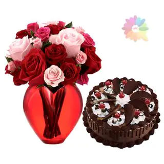 Red and pink roses arranged in glass vase with 1 pound chocolate delight fresh cream cake