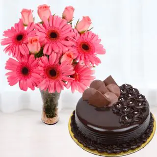 Vase arrangement of 10 pink gerberas and roses with premium chocolate cake 