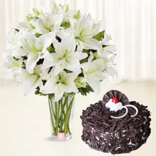 Vase arrangement of 10 white lilies with black forest cake 