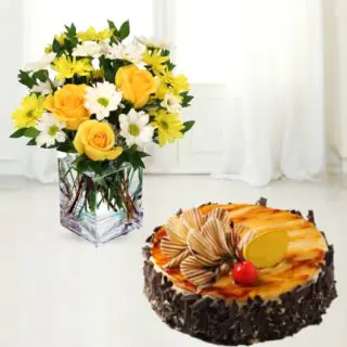 Vase arrangement of 12 gerberas and roses with irish chocolate cake 