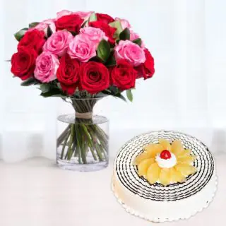 Vase arrangement of 12 red and pink roses with pineapple cool cake 