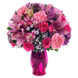 Vase arrangement of carnations, roses with lilies