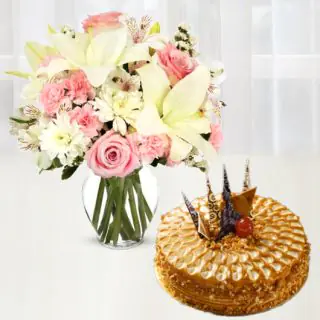 Vase arrangement of lilies, carnations and roses with premium quality butterscotch cool cake 