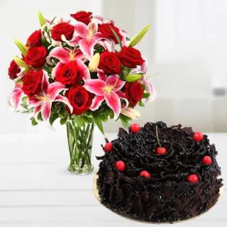 Vase arrangement of lilies with red roses with chocolate fantasy cool cake 