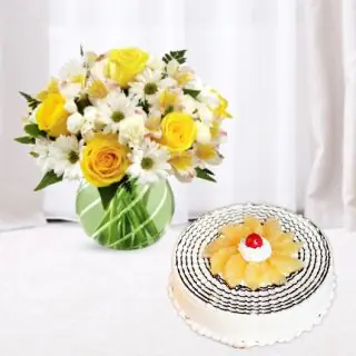 Vase arrangement of mix flowers with pineapple cool cake 