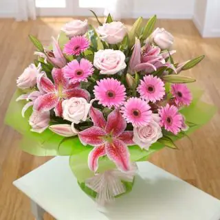 Vase Arrangement of pink lilies with pink roses and pink gerberas 