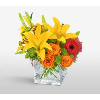 Vase Arrangement of yellow lilies, orange roses with red gerberas 