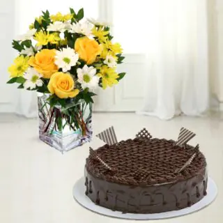 Vase arrangement of yellow roses with white daisy with chocolate cake 