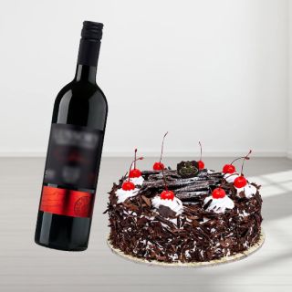 black forest cake with bottle of red wine 