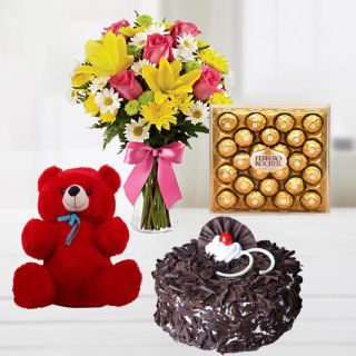 15 mix flowers in glass vase with black forest cake with 6 inch teddybear with 24 pcs rocher ferrero chocolates 