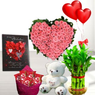 40 pink roses heart shape arrangement , 6 inch white teddybear, Basket of assorted chocolates,  2 layer Lucky bamboo plant ,5 blown balloons with greeting card 